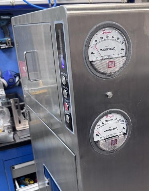 Two Magnehelic differential-pressure gauges on the unit